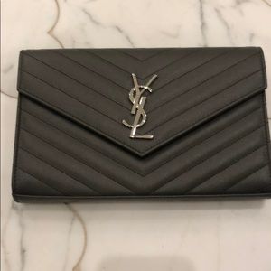 YSL bag with dust bag and receipt.